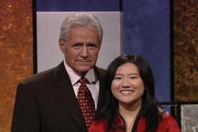 MIT senior Jiaqi 'Jean' Cui poses with Jeopardy! host Alex Trebek.
