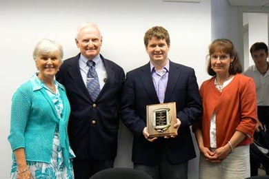 Jeremy Stewart, LFM '10, center, winner of the 2009 Charles "Harrison" Smith Award, with Harrison's family. From left to right: Â Sandra Smith, mother; Charles Smith, father; Stewart (holding award); and Sandy Story, sister.
