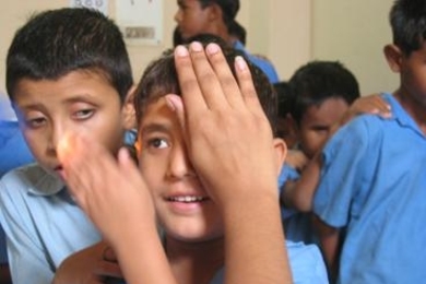 Children are screened for eye problems in New Delhi.