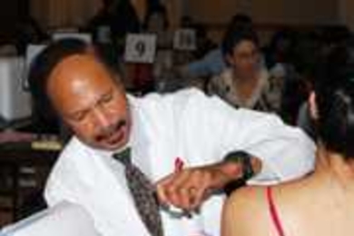 MIT Medical physician assistant George Taylor administers an H1N1 flu shot to a student at the Nov. 17 clinic at MacGregor House.