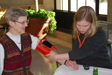 Emily Bassett of Student Financial Services gets her blood pressure taken by EMT Claire Nieman at the getfit@mit kickoff event.