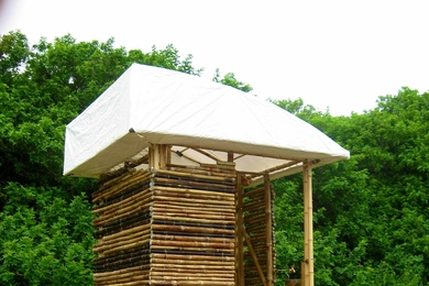 The completed H3 (Hawaii Hygiene Hut) designed for the cluster housing project. The team tested design principles such as the use of bamboo for the structure and fabric for the roof.