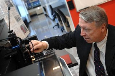 Edwin L. Thomas, head of the Department of Materials Science and Engineering and the Morris Cohen Professor of Materials Science and Engineering, uses a Scanning Acoustic Microscope in MIT's Laboratory for Advanced Materials.