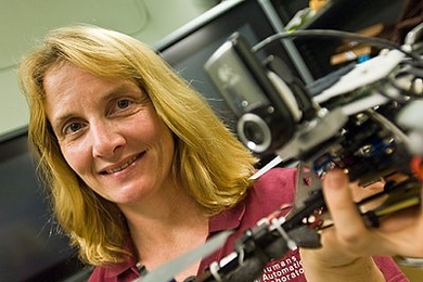 Mary (Missy) Cummings, professor in the Department of Aeronautics and Astronautics and the Engineering Systems Division, holds a quad-rotor.
