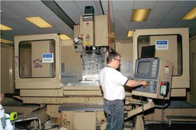 The Laboratory’s machine shop is capable of precision machining of both intricate and large-scale parts. Shown here is a five-axis, computer-controlled milling machine used in fabricating the parts.