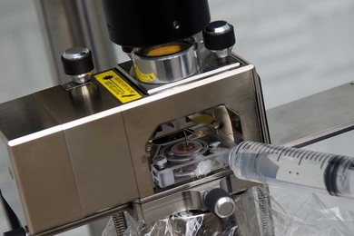 An Atomic Force Microscope, which is used to capture high-resolution images of liquid-solid interfaces.