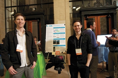 Graduate students Aaron Zinman and Greg Elliott at the IDEAS Competition Project Display and Judging Session.