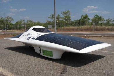 Eleanor charges her battery pack in the hot Australian sun before a test drive in the 2009 World Solar Challenge in October.