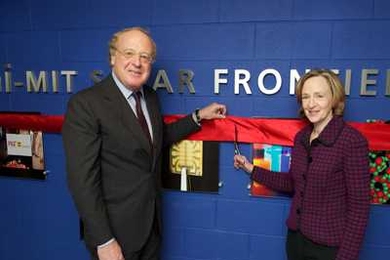 Paolo Scaroni, left, CEO of the Italian energy company Eni, and MIT President Susan Hockfield cut the ribbon to celebrate the opening of the Eni-MIT Solar Frontiers Center (SFC), headquartered on the MIT campus.
