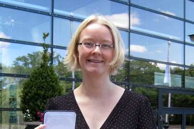 Sarah Weigelt, a Simon's Initiative for Autism and the Brain at MIT postdoctoral fellow, poses with her Otto Hahn medal.