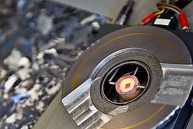 A tiny silicon chip — the glowing orange square at the center of this special heating device — is heated to a temperature well below silicon’s melting point, and then very slowly cooled down. The chip inside this heating device was placed in the path of a synchrotron beam to probe its changes at a molecular level as it went through the retrograde melting process.