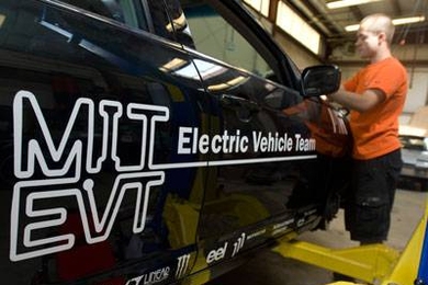 MIT Electric Vehicle Team member Radu Gogoana works on the conversion of a 2010 Mercury Milan to an all-electric powertrain.