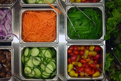 The 100 Main Marketplace features a large, central salad bar.