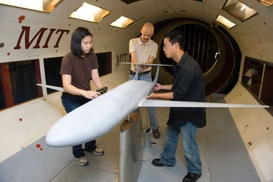 Under Professor Mark Drela's supervision, Department of Aeronautics and Astronautics students Nina Siu and Michael Lieu prepare a model of the D-8 aircraft for testing in MIT's Wright Brothers Wind Tunnel.