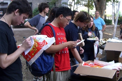 Students browse the free fire-safety giveaways at Campus Fire Safety Day, sponsored by the Division of Student Life and the Environmental Health and Safety office. Held in the East Campus Courtyard, the event also featured staff from MIT Medical, who provided health and wellness information, and staff from MIT’s Security and Emergency Management (SEMS), who talked about emergency preparedness.