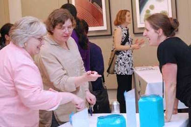Liz Carbone, right, chats with some raffle contestants at the launch event.