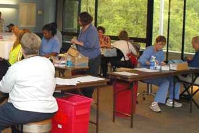 MIT Medical staff members administer flu shots on the third floor of the Student Center.