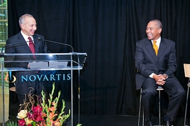 At Wednesday’s announcement, President of the Novartis Institutes for BioMedical Research Mark Fishman, left, was joined by Governor Deval Patrick. The event took place at Novartis’s current Massachusetts Avenue campus.