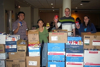 It took several volunteers — including, from left, George Lan, Chelsea He, Tim Curran, Amy Bilton — to weigh, sort, and pack the 1,496 pounds of collected items, which were delivered to the Greater Boston Food Bank.