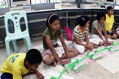 Children participate in a One Laptop Per Child pilot program in Thailand