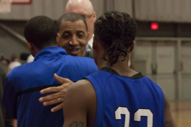 Larry and Paul Anderson embrace as the teams shake hands at the end of the MIT-UMass game in Rockwell Cage last Tuesday night.