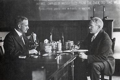 In this photo taken in the 1920s, Samuel Cate Prescott, left, and William Lyman Underwood discuss their canning research.