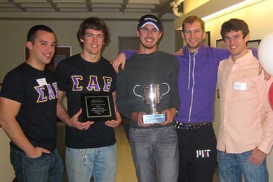 Brothers from Sigma Alpha Epsilon fraternity hold the 2011 Service Cup. From left: sophomore Jancarlo Perez, junior Davey Hunt, and sophomores Scott Landers, Will Drevo and Cameron McAlpine.