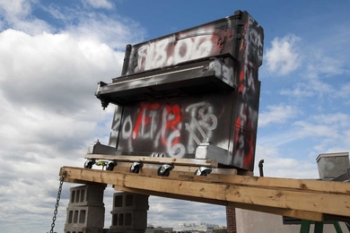 An old piano on the roof of Baker House awaits its launch at the dormitory's annual piano drop. In a tradition dating back to the early 1970s, Baker's residents drop a piano from the six-story building to commemorate the last day to drop classes.
