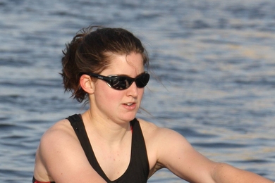 Tess Saxton-Fox rows in boat on water