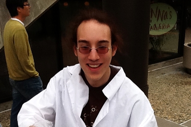 Junior Jayson Lynch, vice president of the MIT Laboratory for Chocolate Science, ladles up free hot cocoa in front of the student center.