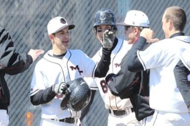 Junior Bryan Macomber celebrates with teammates. 