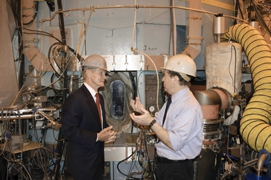 Senior Research Scientist Martin Greenwald (right) discusses the importance of fusion research with Florida Sen. Bill Nelson in front of a port in the Alcator C-Mod tokamak.