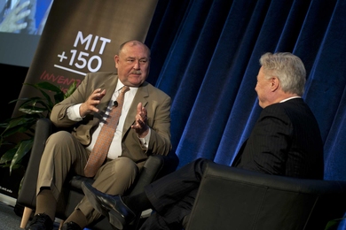 Admiral Thad Allen, left, talks with David Schmittlein, John C. Head III Dean of the MIT Sloan School of Management.