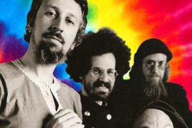 Charter members of the 'Fundamental Fysiks Group,' circa 1975. Standing, left to right: Jack Sarfatti, Saul-Paul Sirag, Nick Herbert; bottom corner: Fred Alan Wolf.