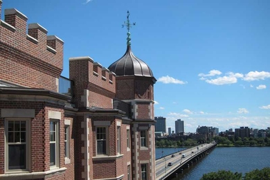 Fariborz Maseeh Hall, originally erected as the Riverbank Hotel, overlooks the Charles River and the Boston skyline.