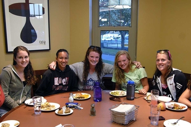 From left, members of the women's soccer team eat in the South dining room with views of the Charles River and Boston skyline: Valerie Andersen '15, Jessica Ong '15, Kaithlyn Nealon '14, Samantha Fleischmann '14 and Meghan Wright '13.