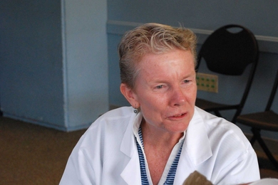 Nurse practitioner Jackie Sherry, MIT Medical’s infection control coordinator, prepares to vaccinate a patient at the Sept. 30 flu clinic.