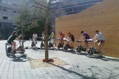 Lauren Hanley, assistant director of fitness for DAPER, left, took her physical education class outside to enjoy the warm weather.
