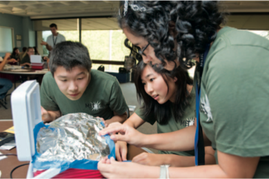 From left to right: Francis Chen, Katherine Lee, and Priyanka Chatterjee, all first-year students, participate in 'Discover Energy: Learn, Think, Apply,' MITEI's freshman pre-orientation program held in August. In the activity shown here, the team works with a set of insulating and sealing materials and a lunchbox that has been retrofitted with an interior light bulb and thermometer. Each team con...