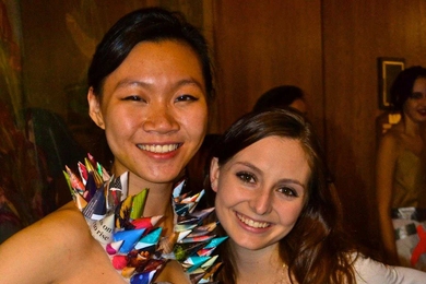 Sophomore Angela Chu dons the winning outfit, which she designed along with sophomore Julianna Mello, that was made from old paper, plastic bags and aluminum. The dress beat out nine other designs modeled at Next House in the Trashion show on Dec. 3. 