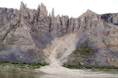 The Siberian Traps were created about 250 million years ago by massive volcanic eruptions. The lava that covered the land formed flat plains as it cooled. Over the millennia, weathering has caused the rock to crack and wear, forming steep mountains. Some rock resists weathering, creating spires of rock. 