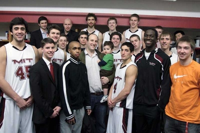 MIT alum and former basketball player, Dan Goodman '01 (center with his son), finds support from the MIT men's basketball team as he battles medical problems.