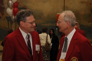 Charles Phillips '61 and Jerry Saltzer '61, SM '63, ScD '66 — fully decked out in red jackets and insignia — enjoy a 50th reunion gathering last year.