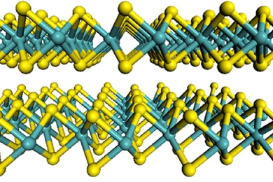 Diagram shows the flat-sheet structure of the material used by the MIT team, molybdenum disulfide. Molybdenum atoms are shown in teal, and sulfur atoms in yellow.