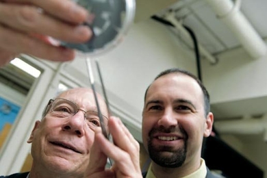Joel Schindall of electrical engineering and computer science (left) and Riccardo Signorelli PhD ’09 of FastCAP Systems examine carbon-nanotube-coated samples that proved key to the development of the full-scale, high-performance ultracapacitors now being marketed by FastCAP. 
