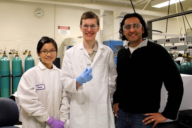 Paper authors (l-r) Yuran Wang, William Gunther and Yuriy Roman show a sample of the inorganic catalyst Sn-Beta zeolites with borate salts