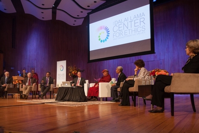 Scholars discussed environmental challenges on Monday at MIT with the Dalai Lama. From left: John Sterman and Kerry Emanuel of MIT; M. Sanjayan, moderator, of The Nature Conservancy and the University of Montana; Thomas Malone of MIT; the Dalai Lama; a translator; Rebecca Henderson of Harvard; and Penny Chisholm of MIT.