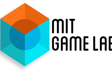A sphere is in the center of a cube with blue sides and an orange top. The text "MIT Game Lab" is next to the cube.