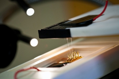 A tiny array of silicon tips sandwiched between electrodes spins out "nanofibers" of plastic that could be useful for a host of applications.