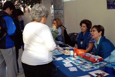 MIT Medical clinicians (from left) Joan Hill, Anna Jasonides and Linda Pasciuto speak with visitors at the World Diabetes Day table.